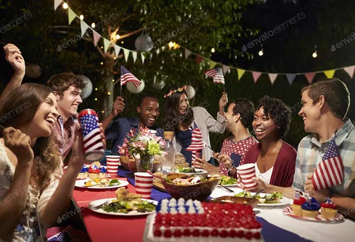 Friends Celebrating 4th Of July Holiday With Backyard Party